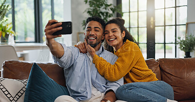 Buy stock photo Home, selfie and couple on sofa, love and bonding together with happiness, relax and smile in living room. Apartment, man or woman on couch, profile picture and relationship with romance or memory
