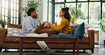 Home, fighting and couple on couch, argument and relationship with divorce, affair and angry. Apartment, man and woman on sofa, disagreement and marriage with conflict, breakup and upset with stress