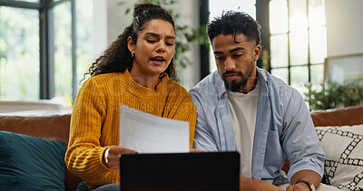Buy stock photo Home, talking and couple with bills in lounge, financial plan and asset management with information. Serious, man or woman with paperwork for analysis, laptop or discussion with report in living room