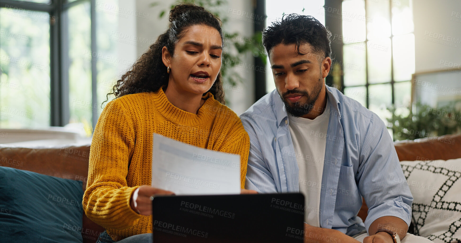 Buy stock photo Home, talking and couple with bills in lounge, financial plan and asset management with information. Serious, man or woman with paperwork for analysis, laptop or discussion with report in living room