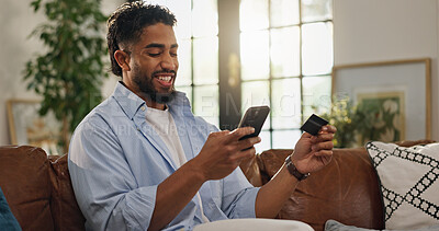 Buy stock photo Man, credit card and phone on sofa for online shopping, smile and easy payment in living room. Person, digital banking and fintech with mobile app, deal and e commerce discount on couch at apartment