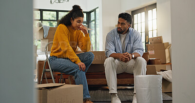 Buy stock photo Frustrated couple, argument and conflict with boxes in new home for relocation or disagreement. Upset, woman or man with packages in living room dispute for financial crisis, debt or mistake in house