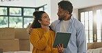 Tablet, smile and moving with couple in new home for property, support and interior design. Real estate investment, layout research and relocation with man and woman in living room of house together