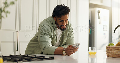 Buy stock photo Home, smile and man in kitchen, cellphone and typing with social media, internet and texting. Online reading, person and smartphone with communication, connection or message to contact or chatting
