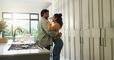Buy stock photo Laughing, couple and hug in kitchen, love or bonding on break in house, commitment or relationship. Happy, man and embrace with woman in home, affection and romance in apartment, care or marriage