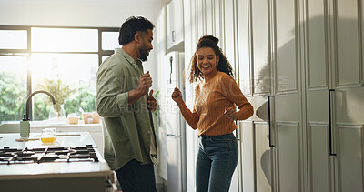 Buy stock photo Love, happy couple and dance in kitchen for celebration, anniversary and romance. Energy, man and woman with music in home for freedom, bonding together and moving to radio for healthy relationship