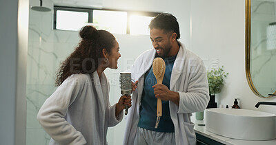 Buy stock photo Couple, dance and karaoke in bathroom with love, energy and excited with morning routine. Singing, man and woman in home with brush for music celebration, rhythm and bonding with partner for romance