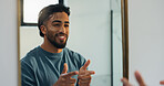 Finger guns, mirror and man in bathroom with confidence for skincare, grooming and health in home. Happy, reflection and person with shooting gesture for hygiene, wellness and morning routine