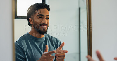 Buy stock photo Finger guns, mirror and man in bathroom with confidence for skincare, grooming and health in home. Happy, reflection and person with shooting gesture for hygiene, wellness and morning routine