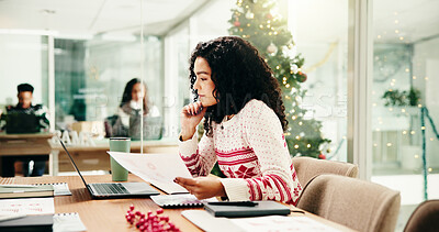 Buy stock photo Woman, documents and laptop at Christmas in office with review, data and festive sweater at workplace. Person, computer and reading with charts, stats and feedback with xmas jersey at insurance job