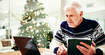 Christmas, tablet and businessman with laptop in office for finance, budget or investment proposal. Digital technology, xmas and mature male financial manager with risk management report on computer.