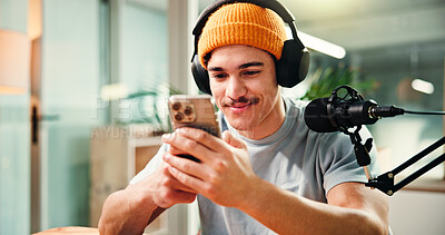 Buy stock photo Creative, influencer and man with smartphone, podcast or reading comments on social media or online. Happy, podcaster and person with mobile app for reviews, content creation and followers on website