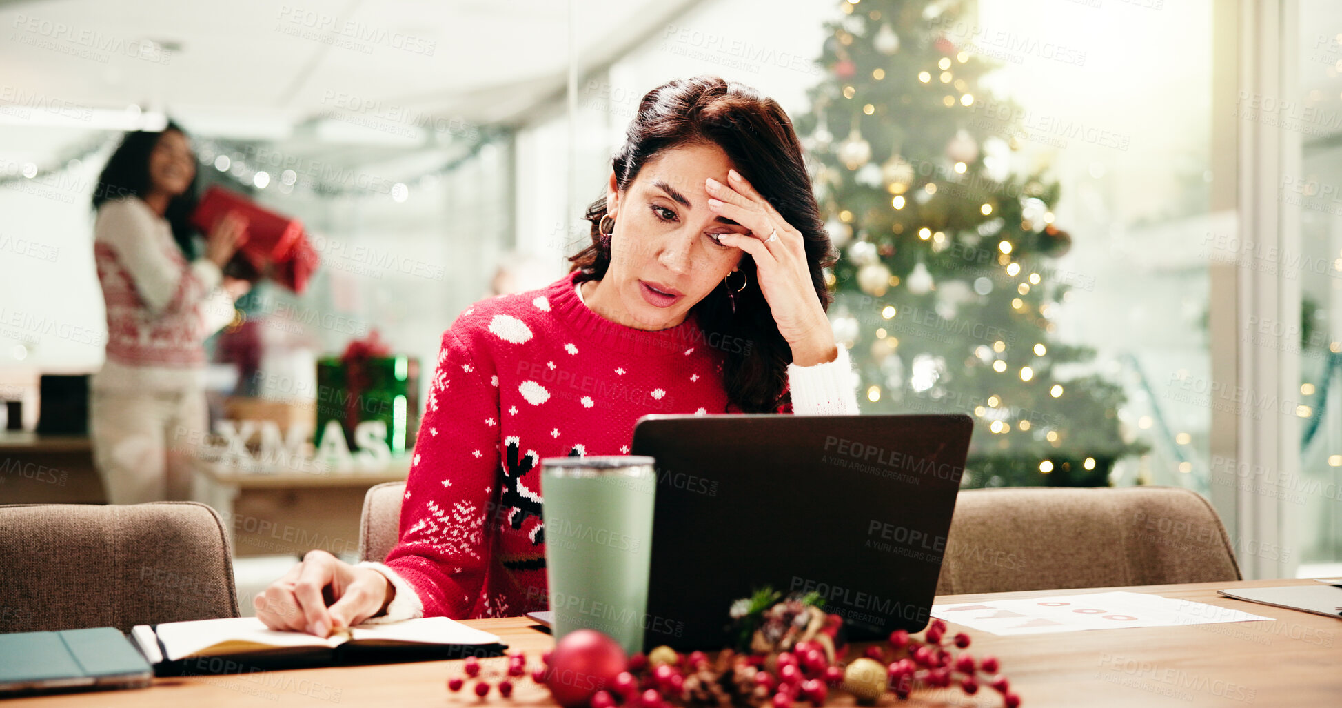 Buy stock photo Office, stress and woman with laptop, Christmas and pressure of holiday campaign on website and app. Anxious, marketing manager and mature person with burnout in festive season, tech or data analysis