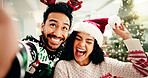 Happy, couple and selfie for Christmas in home, memory and celebration for December holiday or love. Bonding, man and woman with smile for profile picture, festive season and photography in house