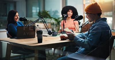 Buy stock photo Podcast, talking and people on tablet in studio with guests for interview, discussion and conversation. Content creation, host and group with mic for recording radio show, broadcast and live stream