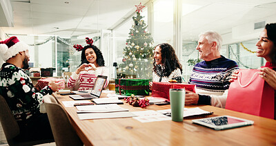 Buy stock photo Christmas, business people and exchange gift in office party with heart hands for gratitude. Xmas, happy workers or giving present with love sign for thank you, appreciation or team celebrate holiday