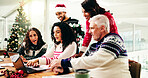 Christmas, laptop and business people in meeting for discussion, brainstorming or finance analysis. Computer, group collaboration and planning in office for risk management, idea or solution on xmas