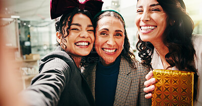 Buy stock photo Christmas, business women and team selfie with gift, festive celebration and POV. Picture, portrait and photo of friends with xmas present for holiday, party or laugh for social media post in office