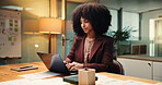 Accounting, laptop and night with business woman in office for finance, investment or report deadline. Computer, financial review and night with African employee at desk in workplace for planning