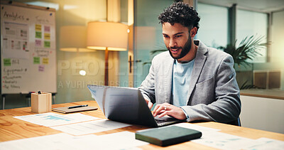 Buy stock photo Businessman, financial analyst or typing with laptop at night for company report in office. Man, accountant or finance advisor working late with computer or documents for budget review in workplace