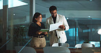 People, tablet and paperwork in office at night for accounting, finance report and budget review. Staff, team and digital for financial audit, company expenses and information on investment deadline
