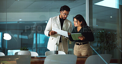 Buy stock photo Businessman, woman and tablet with documents, night and financial review with deadline at office. People, team and tech with paperwork, report and problem solving with application at insurance agency