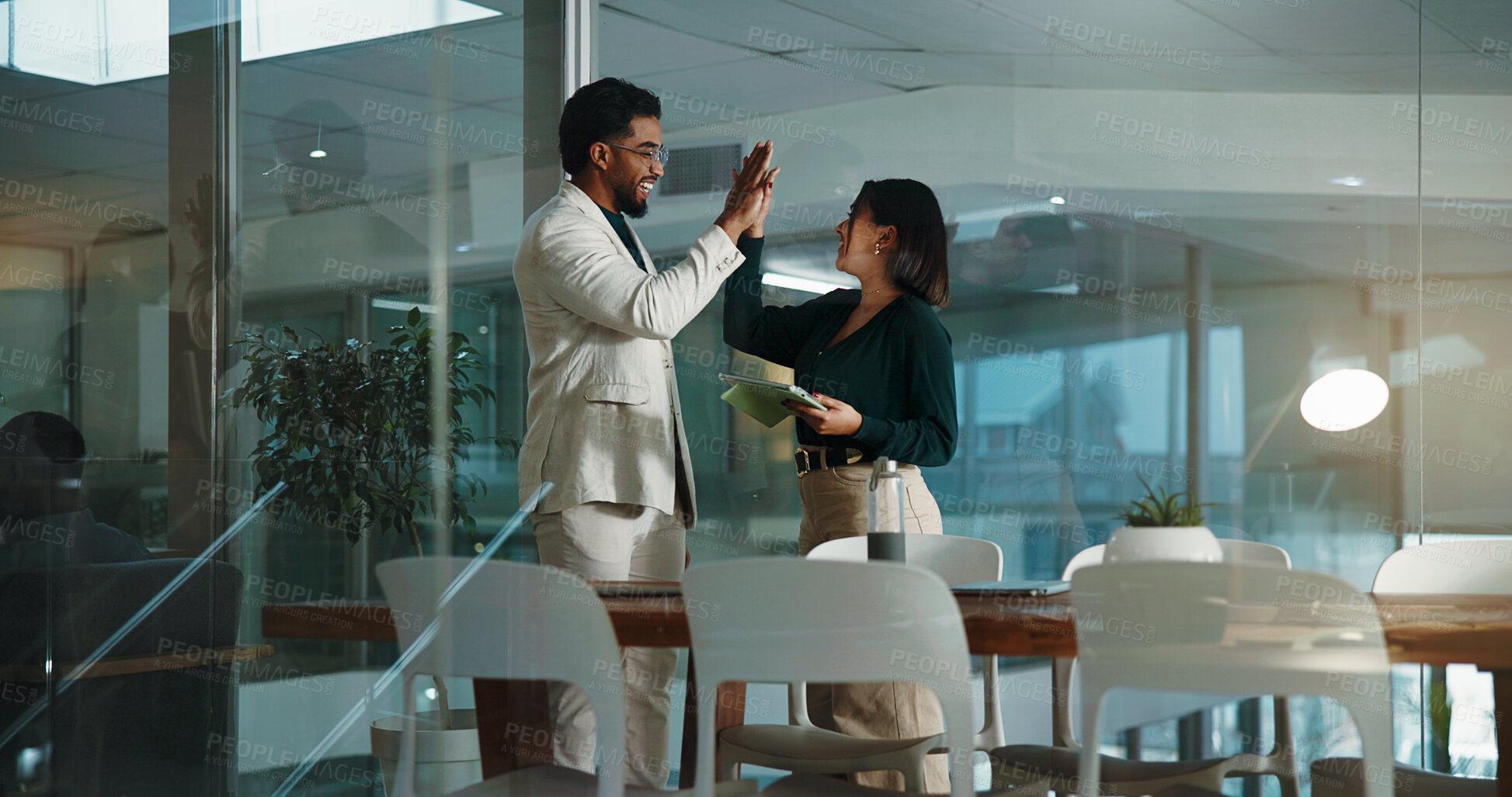 Buy stock photo People, high five and tablet in office at night for accounting, financial success and good news. Staff, collaboration and digital with team win, deadline achievement and feedback for investment deal
