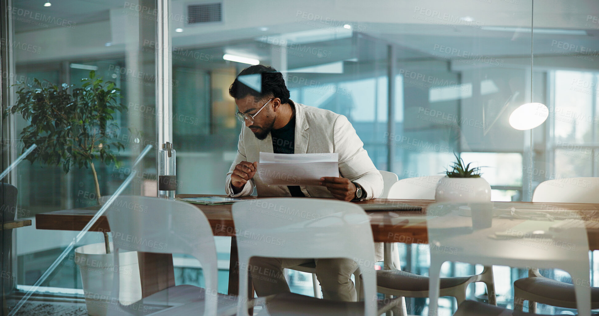Buy stock photo Business, documents and man in office, tablet and online reading for revenue audit. Financial inspector, employee and economist with tech, investment checklist and budget report for company results