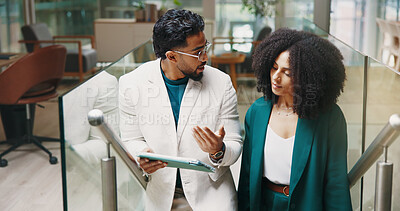 Buy stock photo Talk, stairs or business people with tablet for feedback, investment research and budget. Collaboration, walk and financial advisors in office lobby for news, accounting advice and finance report