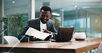 Man, documents and happy at night with finance review, problem solving and profit report at office. African person, broker and smile with paperwork for overtime, feedback or revenue results at agency