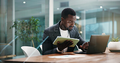 Buy stock photo Laptop, tablet and black man in office with typing for finance report, planning or proposal. Research, digital technology and African male financial manager with computer for business investment.