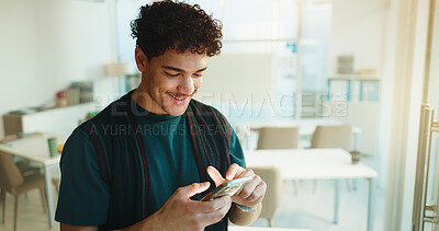 Buy stock photo Education, student and happy man with phone in university classroom for course information. Mobile, college and person with app to check schedule for learning, development and email for scholarship