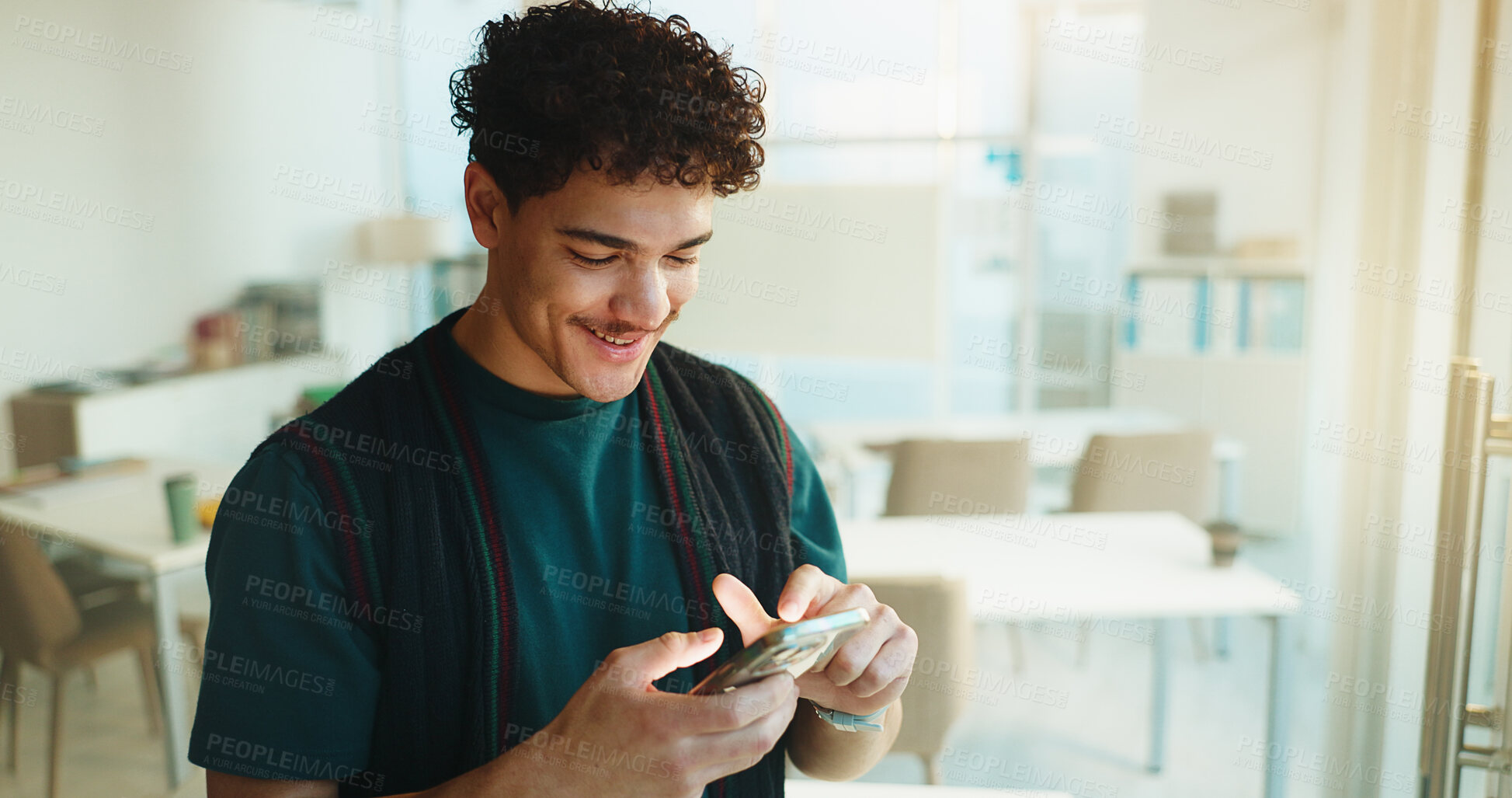 Buy stock photo Education, student and happy man with phone in university classroom for course information. Mobile, college and person with app to check schedule for learning, development and email for scholarship