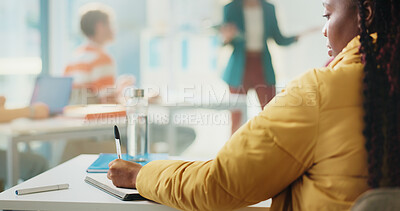 Buy stock photo Woman, student and writing with book in classroom for higher education or learning in university. Back view, female person or academic learner taking notes with teacher for knowledge or development