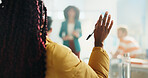 Woman, student and hands raised with teacher for question, engagement or interaction in classroom. Back view, female person or academic learner with answer or ask for education, learning or knowledge