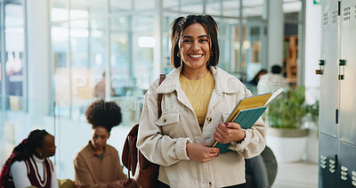 Buy stock photo Girl, college student and portrait with books at campus with pride, education and smile for scholarship. Woman, happy and confidence in hallway, learning and development with knowledge at university