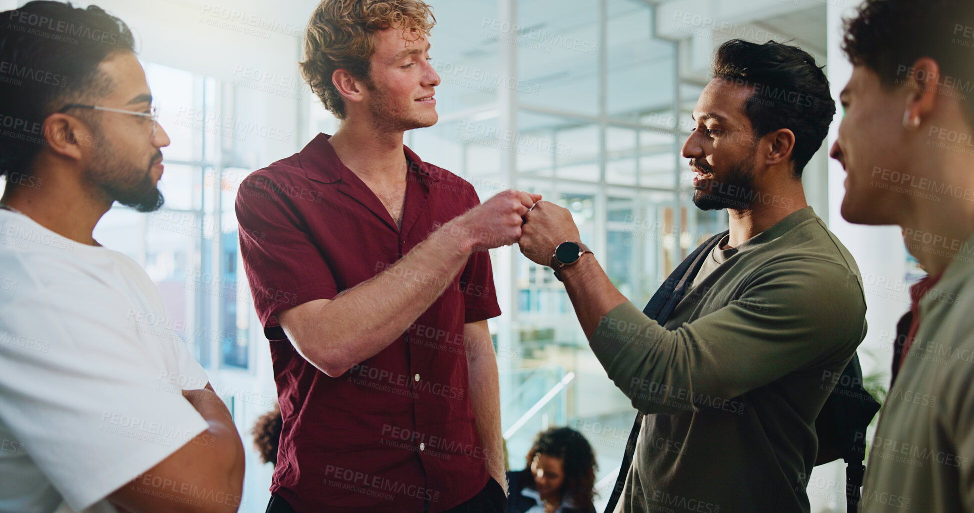 Buy stock photo Students, men and fist bump with group at college for greeting, respect and education at campus. People, friends and happy together for reunion, hello and back to school for development at university