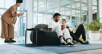 Buy stock photo Men, students and friends with phone for college, schedule and chat on lobby beanbag. People, smartphone and talk with mobile app, relax and social media post for university announcement or learning