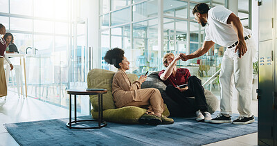 Buy stock photo Fist bump, meeting and students in college for greeting, study group and education support. University friends, scholarship success and thank you with people in campus lounge for exam achievement