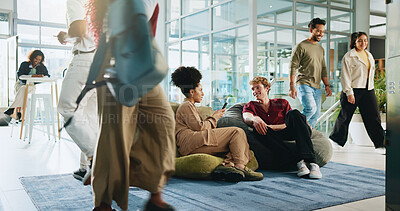 Buy stock photo People, students and friends with phone for college, schedule and chat on lobby beanbag. Man, woman and talk with mobile app, relax and social media post for university announcement or learning