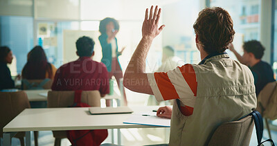 Buy stock photo Student, man and raised hand in classroom at university with learning, notes and question for education. Person, back and attention with scholarship, gesture and solution with discussion at college