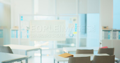 Buy stock photo Empty classroom, desk and chairs for learning at college with lens flare, board and table in hall. Blurred room, campus and furniture at venue for scholarship, development and interior at university