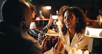 Buy stock photo Happy couple, night and holding hands with date in restaurant for fine dining or anniversary. Man, woman or romance with wine or love for romantic dinner, valentines day or evening out together