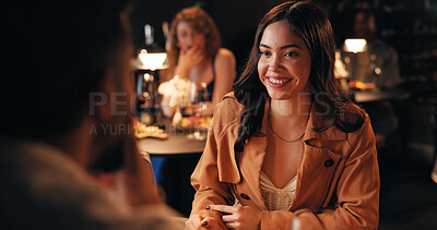Buy stock photo Conversation, date and smile with couple in restaurant at night for bonding or celebration. Fine dining, romance and love with people at table together for anniversary, cuisine or relationship chat