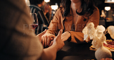 Buy stock photo Holding hands, date and relax with couple in restaurant for romantic anniversary, bonding and fine dining chat. Connection, love and marriage commitment with people at night for dinner and support