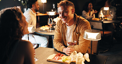 Buy stock photo Love, wine and date with couple in restaurant for bonding, romance and fine dining at night. Anniversary celebration, trust and marriage partner with man and woman at table for loyalty and flirting