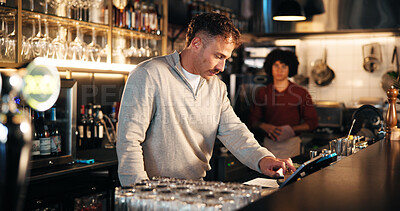 Buy stock photo Bartender, manager and tablet at pub for POS, inventory checklist and inspection for small business service. People, bar man and digital technology with app for menu, feedback or hospitality review