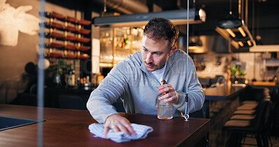 Buy stock photo Pub, owner and cleaning with cloth for hygiene, dust and service for drinks at restaurant. Man, bartender and check for dirt with spray bottle, shine and cafe with inspection at small business