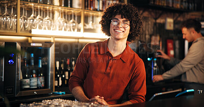Buy stock photo Smile, man and bartender at counter in pub for friendly welcome, customer service and hospitality. Small business, manager and pride at restaurant for taking orders, portrait and ready for happy hour