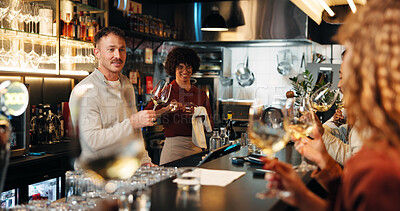 Buy stock photo People, bartender and wine tasting with customers in pub for brewery or craft in restaurant. Barman, sommelier or alcohol professional talking to group for drink test, hospitality or service in bar